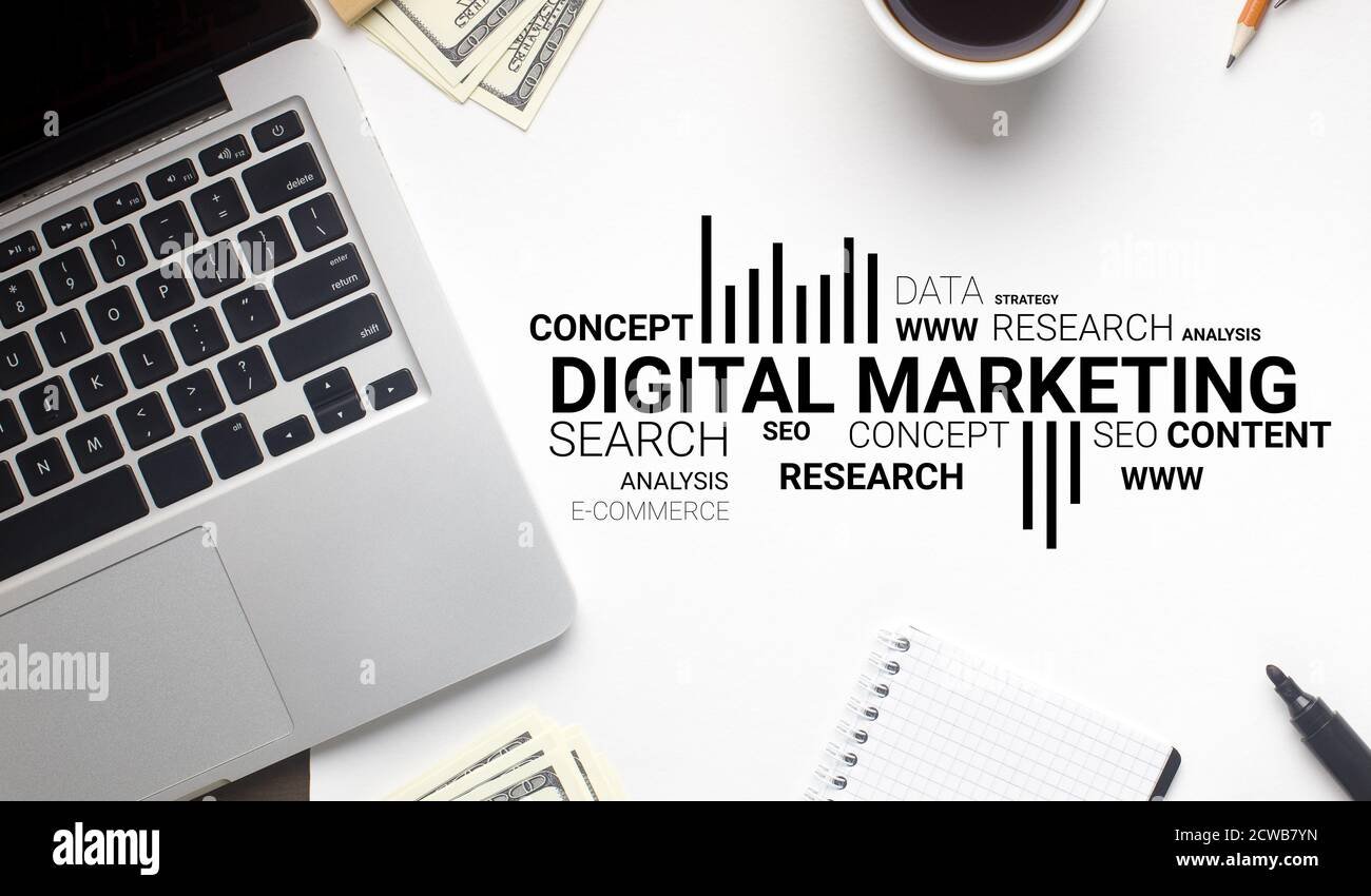 digital marketing wordcloud over white office desk background with laptop 2cwb7yn